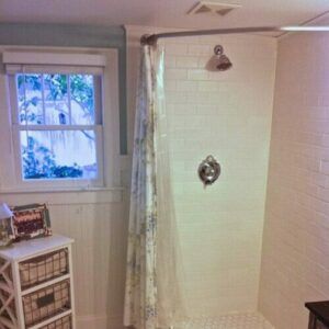 Our finished bath with my special shower curtain rod